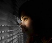 girl_peeking_out_of_window_1829640.jpg