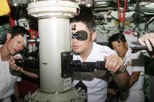 US_Navy_060221-N-5539C-066_Japanese_submarine_JDS_Oyashio_(SS_590)_crewmembers_look_through_the_.jpg