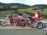 extended_trike_with_two_blown_v-8_engines_wheelie_bar_dual_rear_wings_roll_bar_and_he_doesnt_eve.jpg