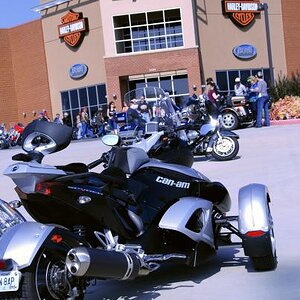 Spyder visits the Harley Davidson Dealership.  Ooops, got to leave now, everybody is pouring out of the dealership and asking "What model (HD) is that