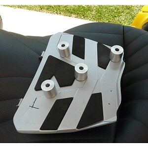 The spacers were set up so that they would not interfer with latches on the sport rack.  However, the bottom right bolt was drilled to go through this