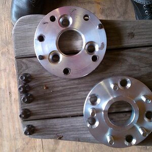 Custom two piece adapters I had made to go from 3 lug to 5 lug