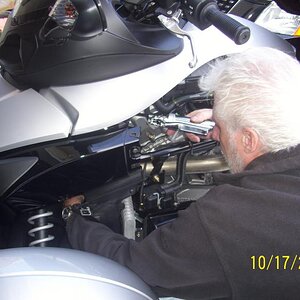 Greasing the suspension. This requires a right angle end on the gun, and also an extra long hose helps.