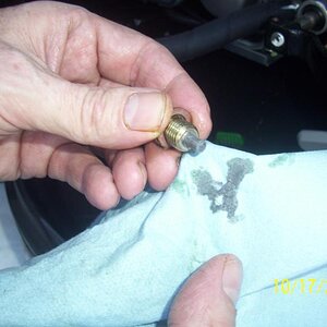 This is the plug magnet, nothing really unusual here. It looks like some engine assembly lube settled to the bottom of the sump. Any particulates wher