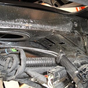 Corrosion behind brake fluid reservoir.