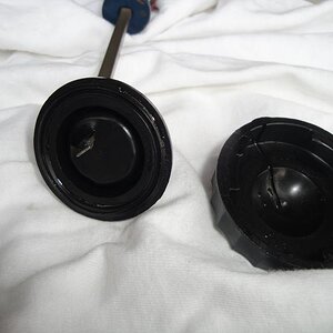 Brake fluid reservoir cap and seal with hole.