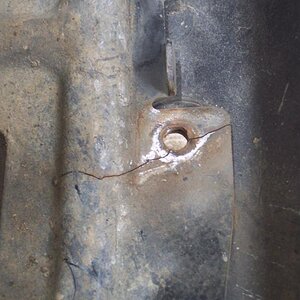 The upper left mounting hole.