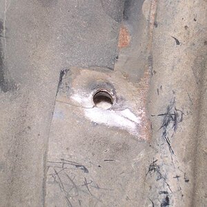 The upper right mounting hole