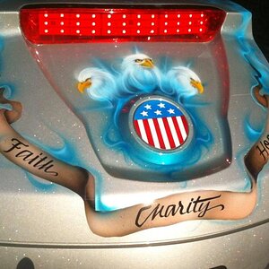 "Faith, Hope, Charity, but the greatest of these is charity"
and the three eagle heads, over the flag emblem,  represents the Trinity.