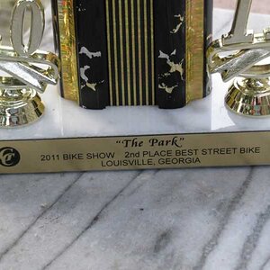 Close up of placard on front of trophy