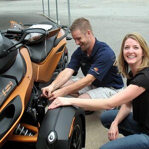 Bradford learning to check oil with Ryan Stephens, service manager at Bradford Marine