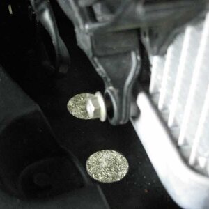 Loosen lower right fan mounting bolt