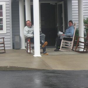 Butch & Kelly enjoying the rocking chairs at the Microtel while waiting for a break in the weather.