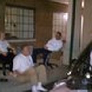 Relaxing in the parking lot at the EconoLodge in Lexington, KY. No chairs on the "porch" so we brought out the wheely chairs from our rooms.