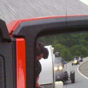 Mirror shot of the Carravan following Lamont to Maggie Valley