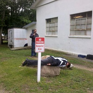 Brian Taking a pic of Deb "Planking" in the Dumpster area - LOL