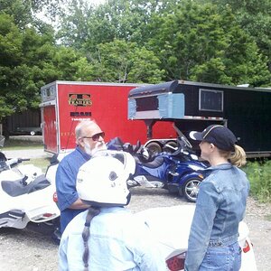 Fred Rau & his wife talking with Denise at the Wheels Thru Time museum