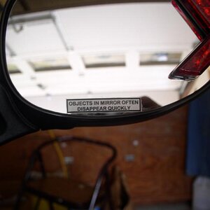 My least expensive mods.  The LED turn signal from PEPBoys $10. The mirror lable $1.