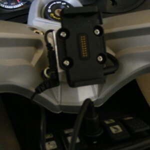 Garmin Mount with mic connection mounted on an external piece of metal.