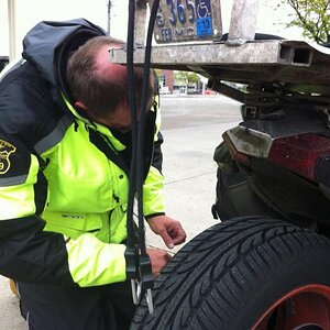 Butch working on Seth's tail lights on the ride home.
