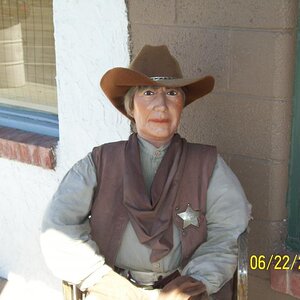 Sheriff sitting on porch of Mercantile, Willcox, AZ