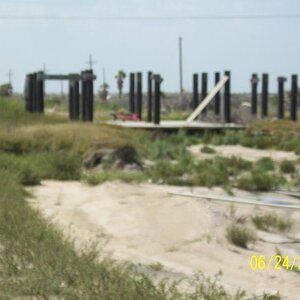 Pilings minus the house. Many like this on Boliver Beach.