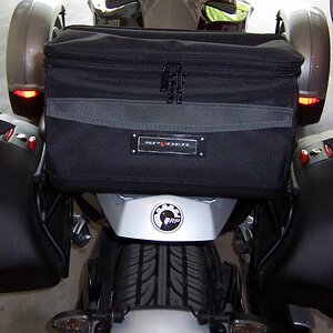 Stanley tool bag bolted to sport rack plate.  Carries rain gear, maps, spare parts.