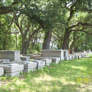 Private cemetery off a cane field, Franklin, LA area.