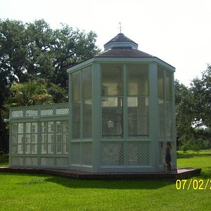 The aviary; no birds. Used to have parrots but they sickened and died.