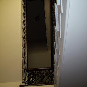 Stairwell looking straight up from the bottom floor.  The mansion has no elevator.  The owner, in his 70's still uses the stairs.  The top two stories