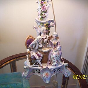 Not bisque or Dresden, some other fancy/costly china. Old too.