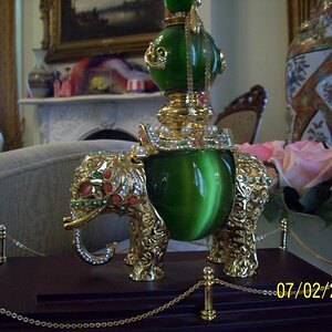 Elephant from India. 3 green cats eyes and jewels.