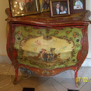 Looked like decoupage to me, but older than dirt.