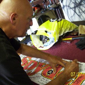 Dudley signing SpyderLover banner.