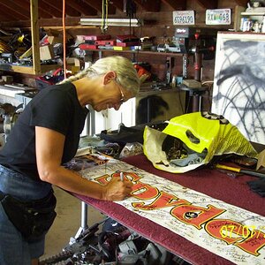Jennifer signing Spyderlover banner.