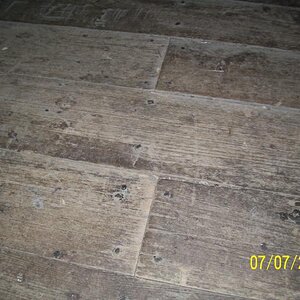 Cabin floor detail.  Notice square-headed nails.  Some plants has wood dowels.