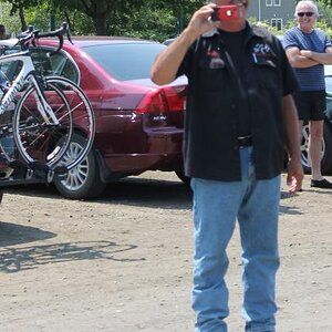Lamont taking pictures at the start of the parade