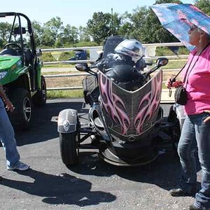 Linda Austin (L) and Flamingo Babe admire the new flamingo umbrella that Linda bought her.