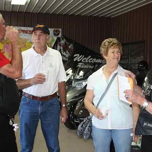 The Glory Riders in their black vests talk to some newer riders from Owensville, Missouri.