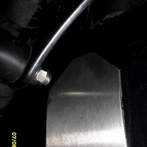 Original Spyderpops Belt Guard Bracket held in Place by my
Stainless Steel Bracket -  To keep it away from the Tyre 

Made by Eddie Sheppard 
Reading 