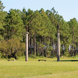 Four thirty foot columns with Greek goddesses