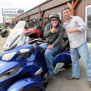 Len showing me the particulars & wishing me safe riding