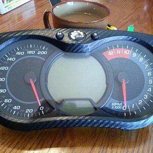 finished product, no more boring black. The gauges are now wrapped in textured Carbon Fiber Vinyl wrap.