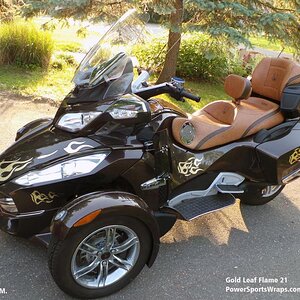 gold leaf flames 21  mounted on a Lava RT & wow what a classy look it adds to this color machine.. Email: pete@powersportswraps.com