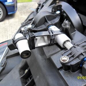 Side view of all Zip ties used for the middle bracket 
Note - Foam rubber used below the the middle bracket for it to rest on when in the down positio