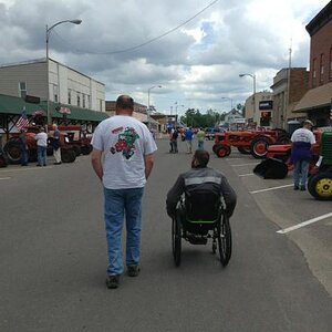 My two guys checking out the street vendors, bikes, tractors and cars in Grantsburg, WI