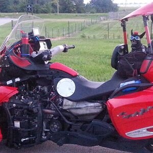 Teddy ryde'n redneck style with a stripped sled at the airport viewing area