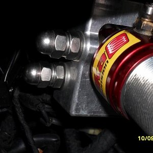 Looking towards the front of the Spyder S/S Dome nuts fitted to keep dirt ect off the bolt threads fitted after the S/S Nyloc nut and washer