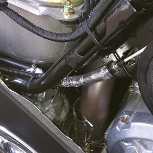 Brake master cylinder and parking brake cable heat shielding