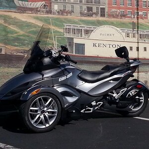 Maysville, KY in front of the painted wall.